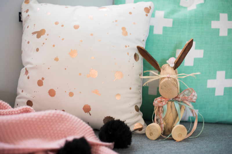 white cushion with gold