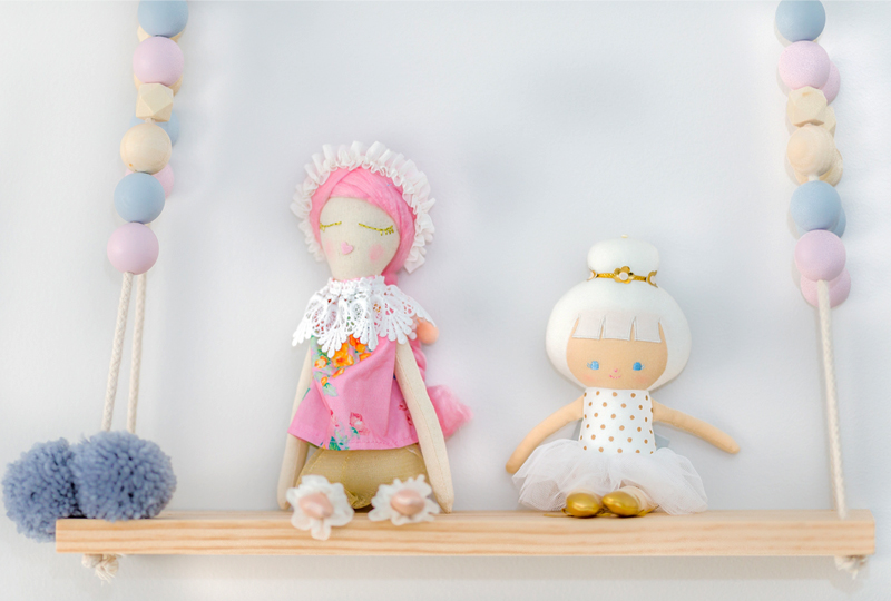 dolls on shelf girls room