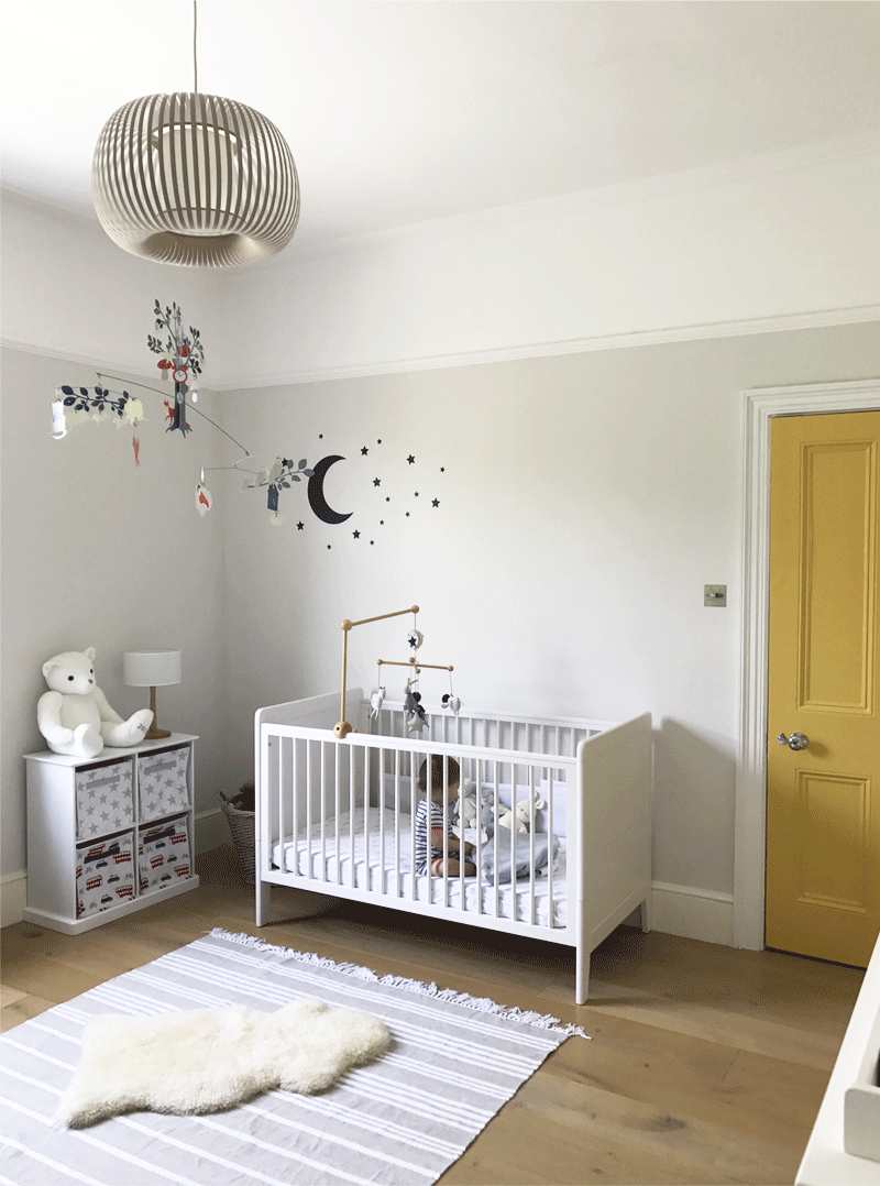 white nursery with yellow pops
